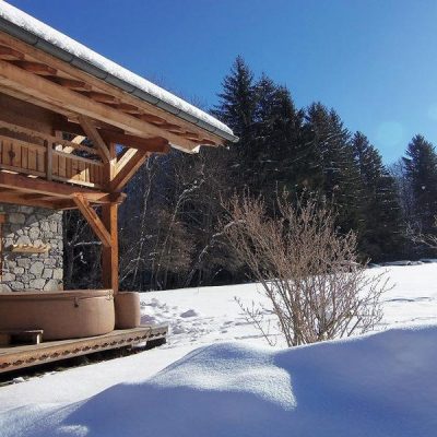 Chalet Holiday Morzine with outdoor hot tub surrounded by snow