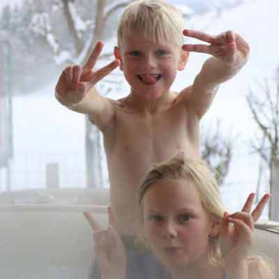 chalet outdoor hot tub children having fun